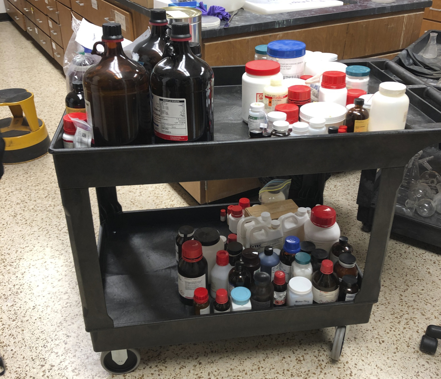 Cart with surplus chemical bottles