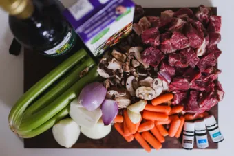 various colorful foods are displayed prepped and ready to cook